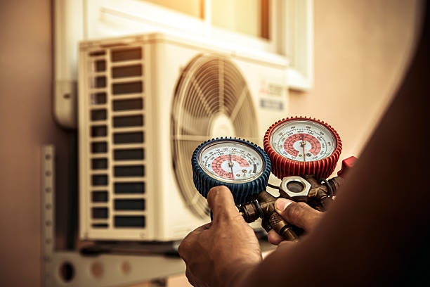 Professional Air Conditioning Service technician working in Atwood, KS